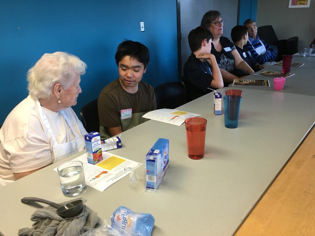 Seniors and youth cooking up a storm together in Victoria.