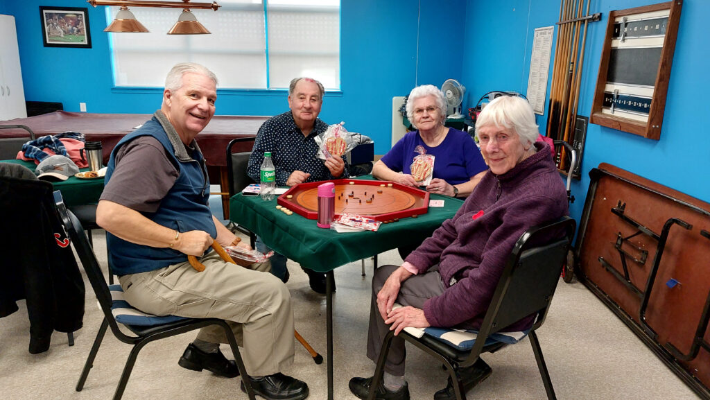 Happy Older Adults Receive Valentine's Cookies and Cards