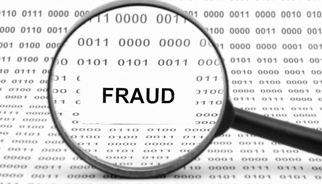 Fraud image with data background under a magnifying glass