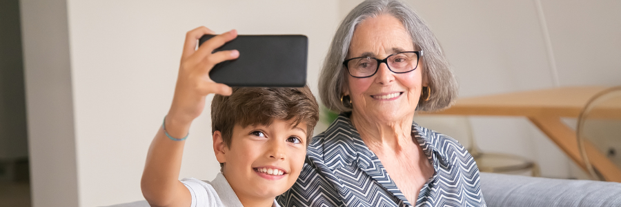 Child takes selfie with grandmother.