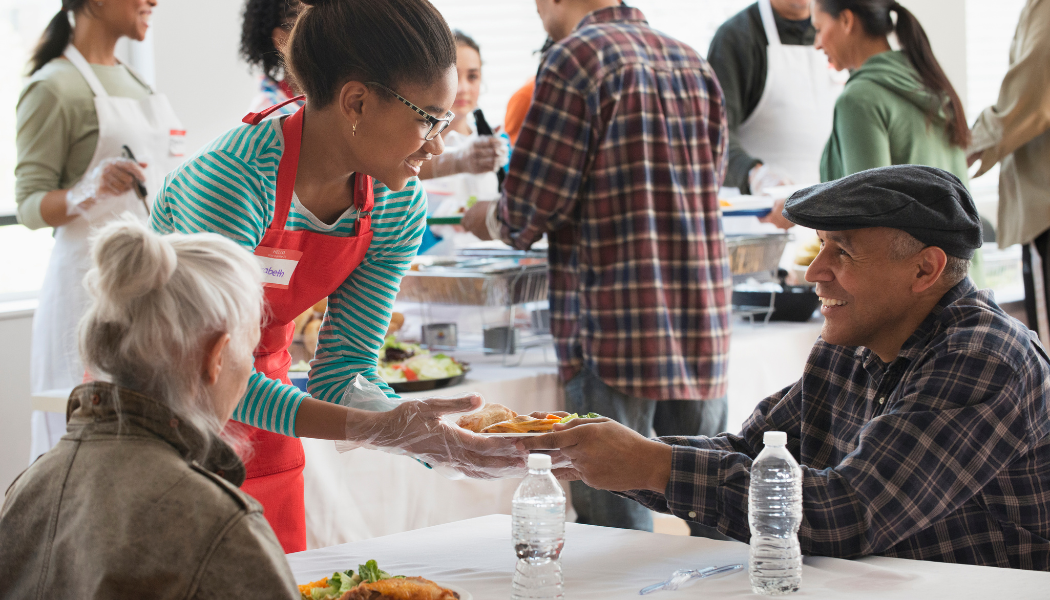 BC CRN blog cover: volunteer serving guests a meal