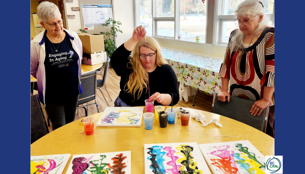 Group of ladies creating string art on canvases