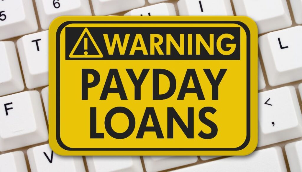 Yellow pay day loan warning on keyboard.